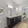 bathroom with modern finishes, a closet and ample counter-space